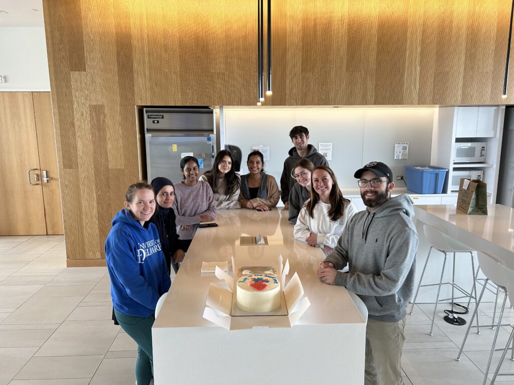 Picture of team members having a celebration after the Biology Research Day